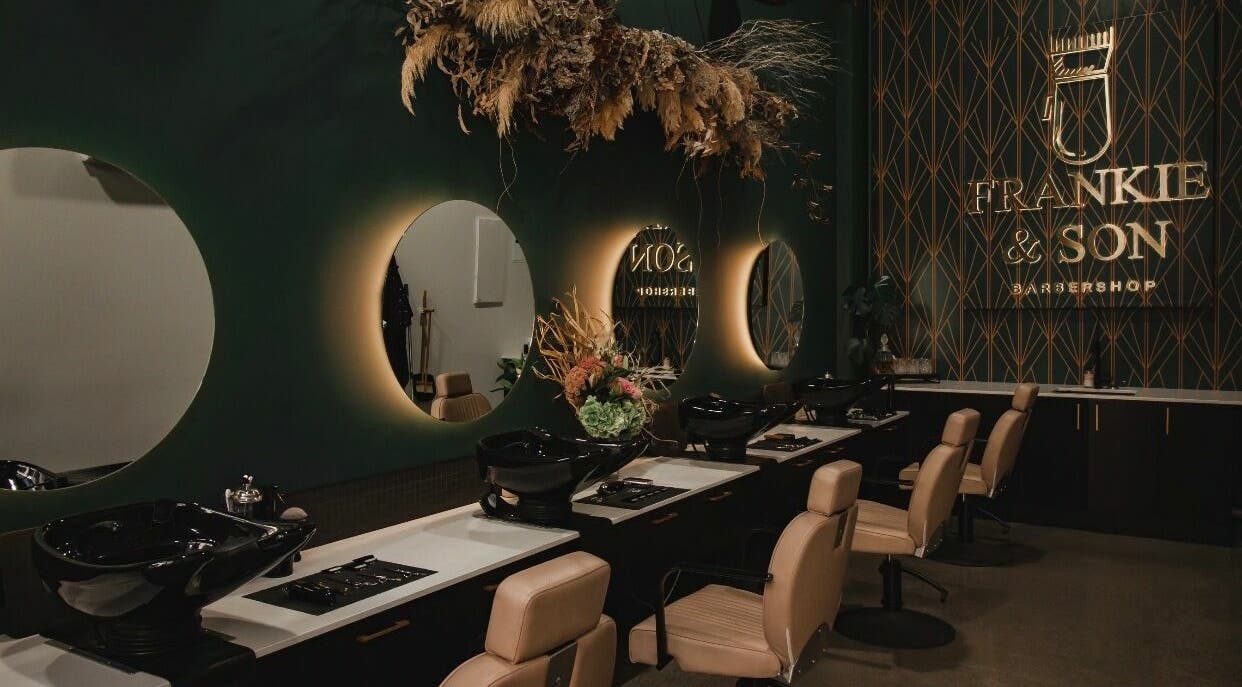 Modern interior of Frankie and Son Barbershop Riverside in Christchurch, Canterbury, NZ with stylish mirrors and decor.