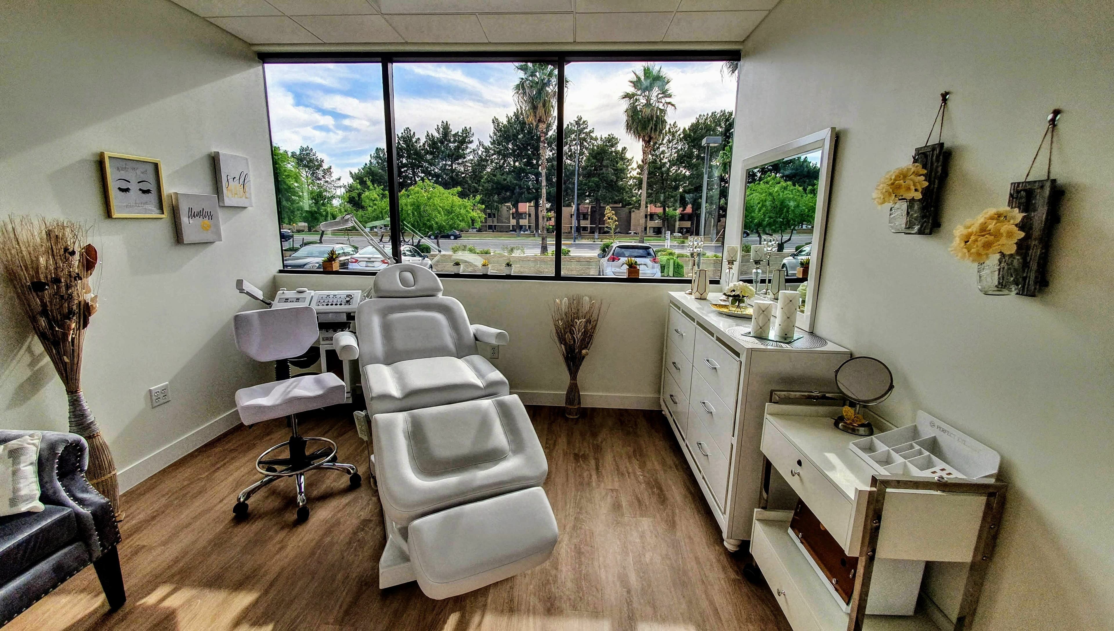Bright treatment room at Euro Glam Gilbert, Gilbert, Arizona, US, featuring a modern reclining chair and decor.