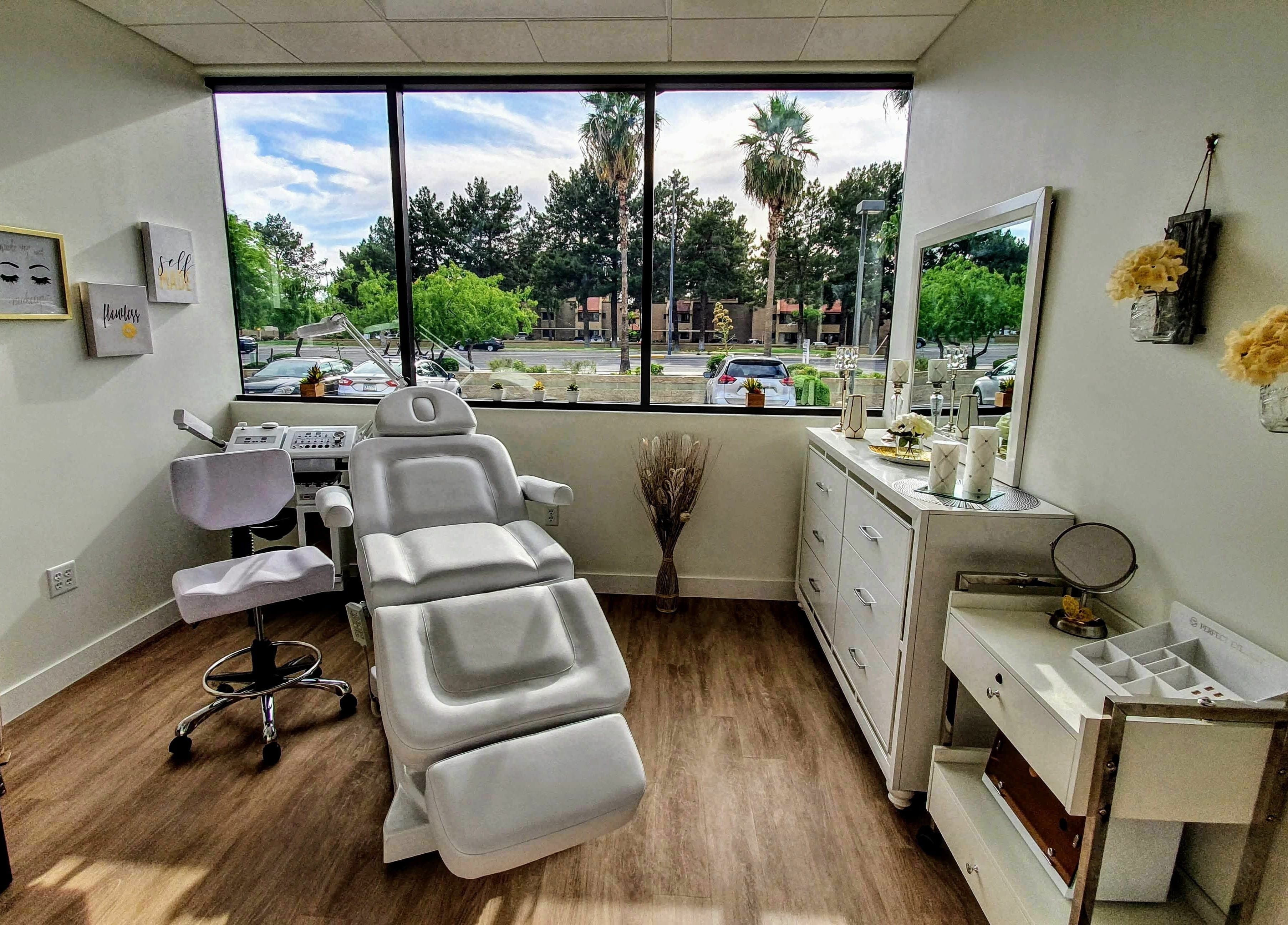 Bright treatment room at Euro Glam Gilbert, Gilbert, Arizona, US, featuring a modern reclining chair and decor.