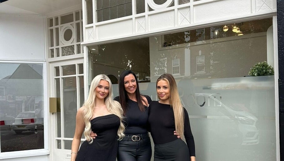 Team in front of The Beauty Room at Bournemouth, England, GB showcasing stylish entrance and friendly staff.