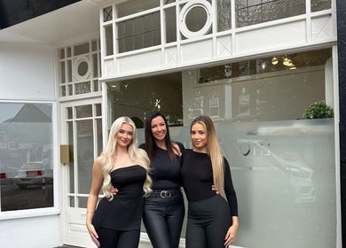 Team in front of The Beauty Room at Bournemouth, England, GB showcasing stylish entrance and friendly staff.