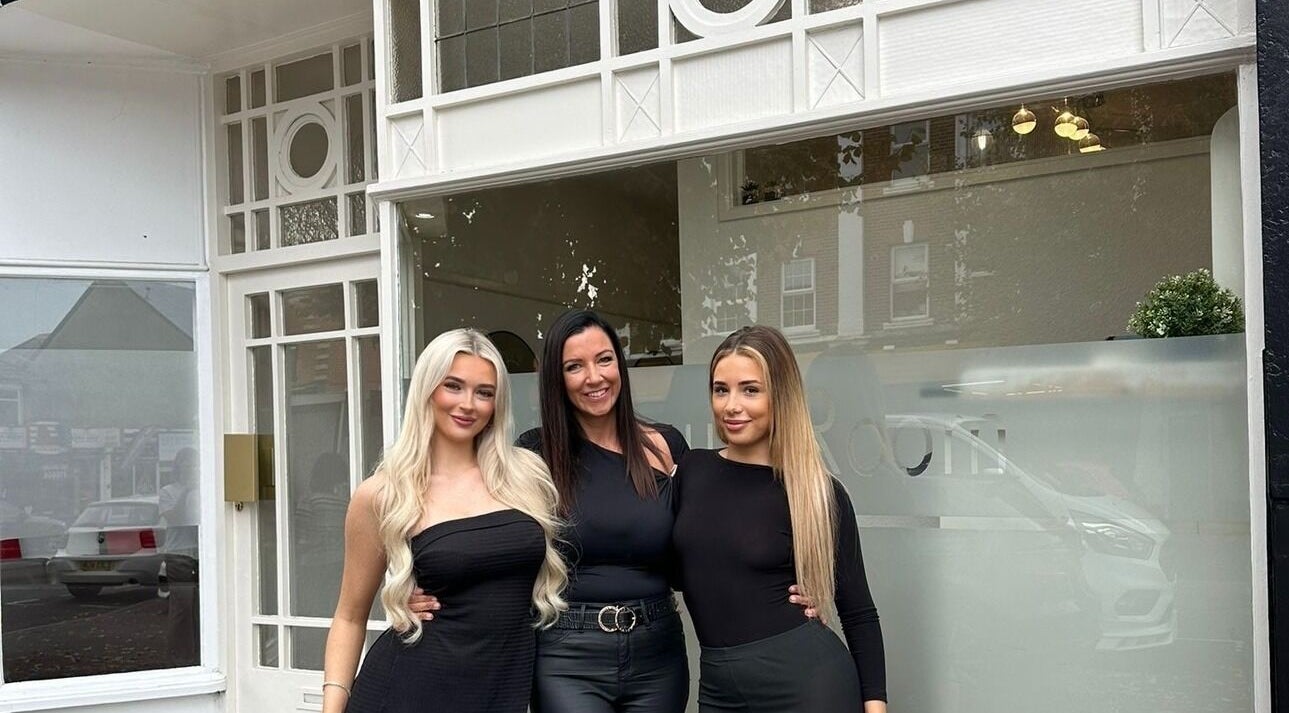 Team in front of The Beauty Room at Bournemouth, England, GB showcasing stylish entrance and friendly staff.