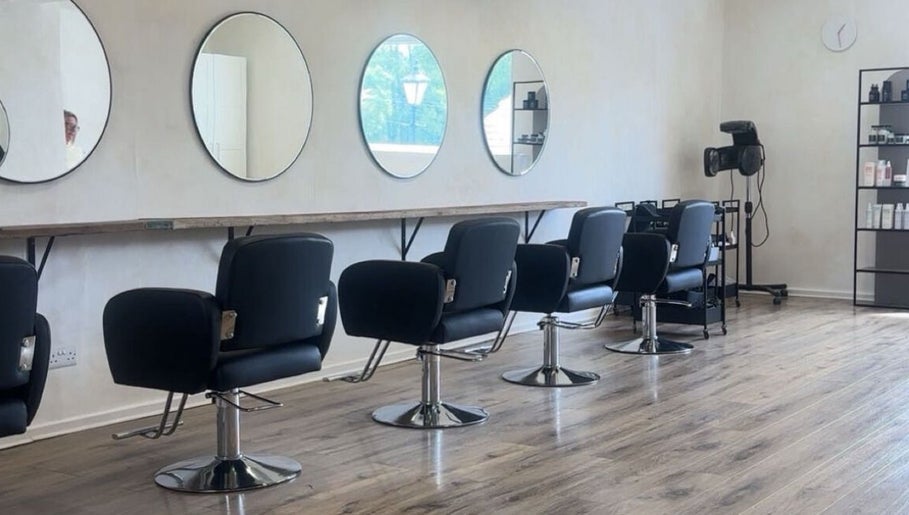 Elegant interior of Misha Greaves Hairstylist, Garstang, England, GB, featuring stylish salon chairs and mirrors.