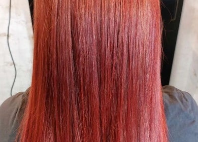 Vibrant red hair expertly styled at Angel Wellness Centre Salon in Birtley, England, GB.
