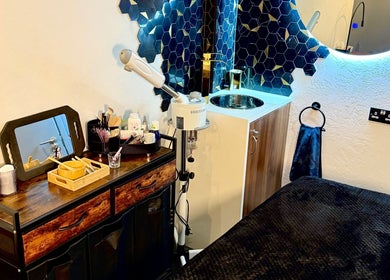 Olive Beauty & Aesthetics - Marston Mortaine, England GB; cozy treatment room with spa decor and equipment.