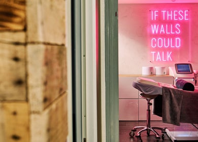 Therapy room with neon sign at Olive Beauty & Aesthetics - Woburn Sands, Milton Keynes, England, GB.