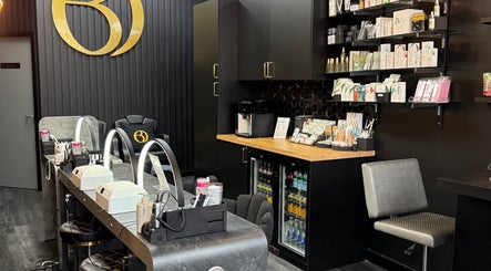 Stylish interior of Olive Beauty & Aesthetics - Marston Mortaine, Marston Moretaine, England, GB with beauty products.
