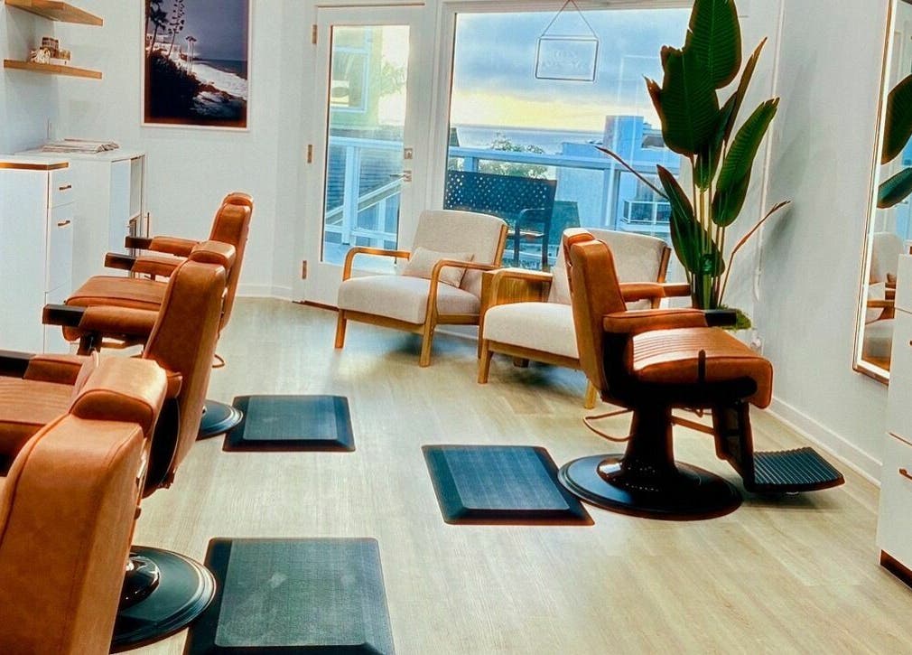 Modern salon chairs at IN STYLE Men’s Salon Laguna Beach & Lake Forest, Laguna Beach, California, US.