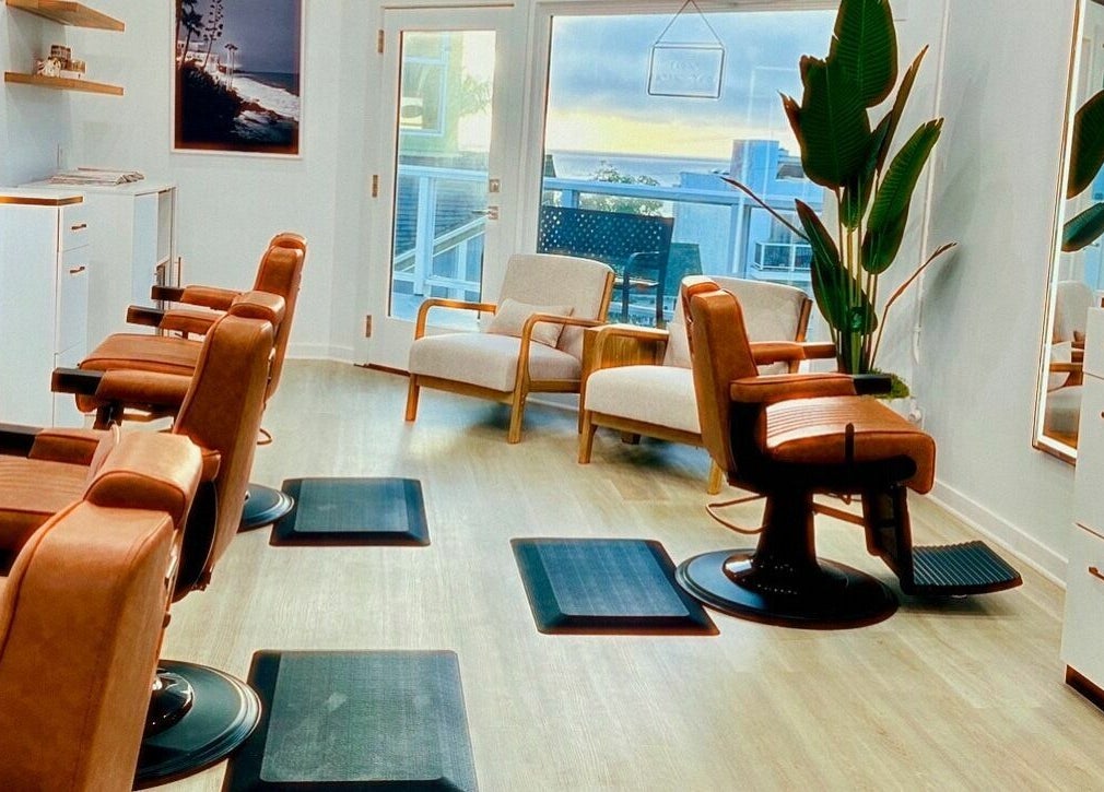 Modern salon chairs at IN STYLE Men’s Salon Laguna Beach & Lake Forest, Laguna Beach, California, US.