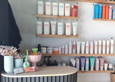 Product shelves at Lil Frenchie Hair at Saint Richards, Glebe, New South Wales, AU, showcasing beauty products.
