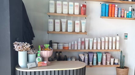 Product shelves at Lil Frenchie Hair at Saint Richards, Glebe, New South Wales, AU, showcasing beauty products.