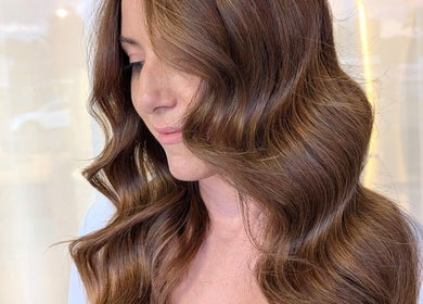 Elegant brown waves hairstyle at Colorbox Hair, Coomera, QLD, AU.