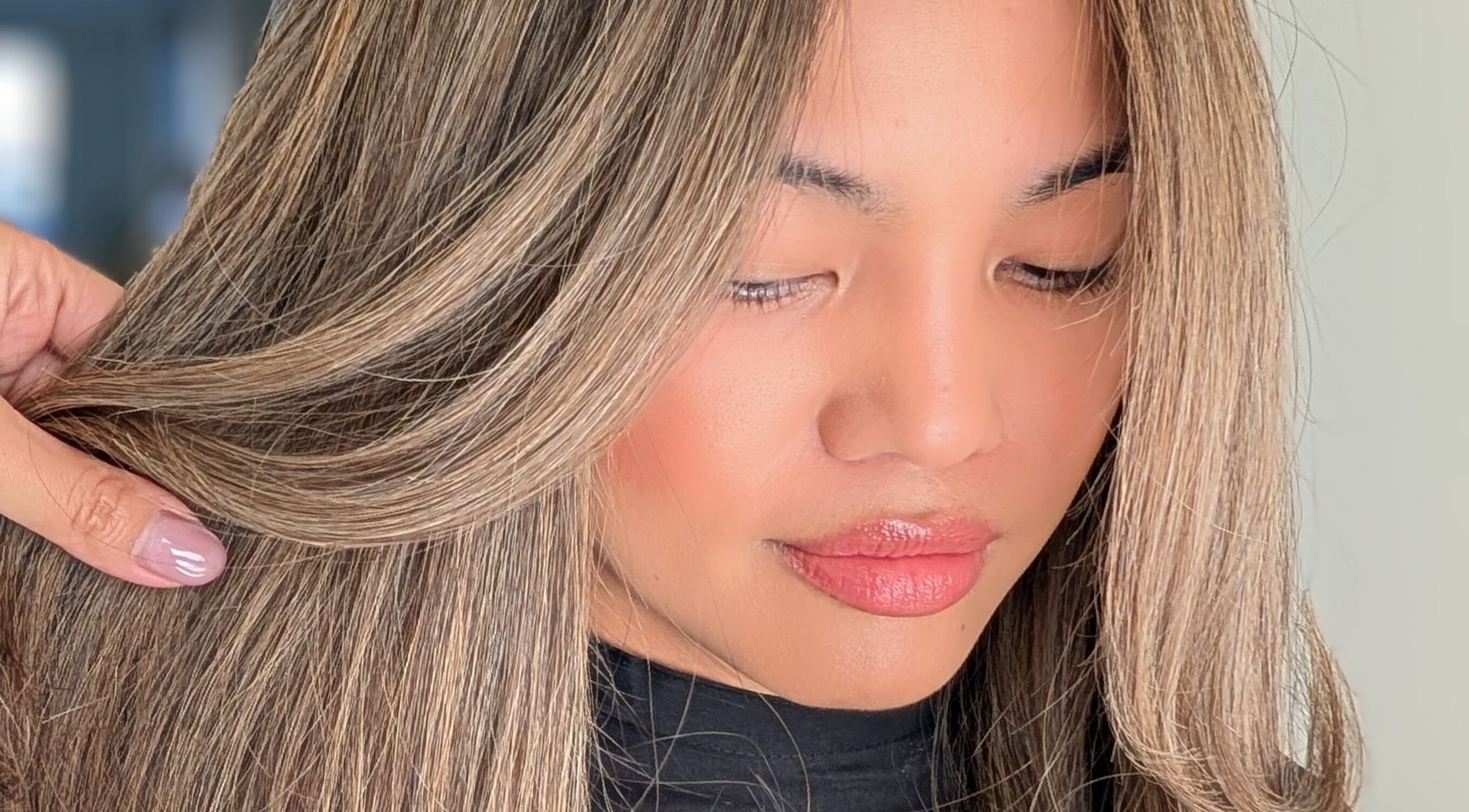 Woman with highlighted hair styled at Colorbox Hair, Coomera, QLD, AU.