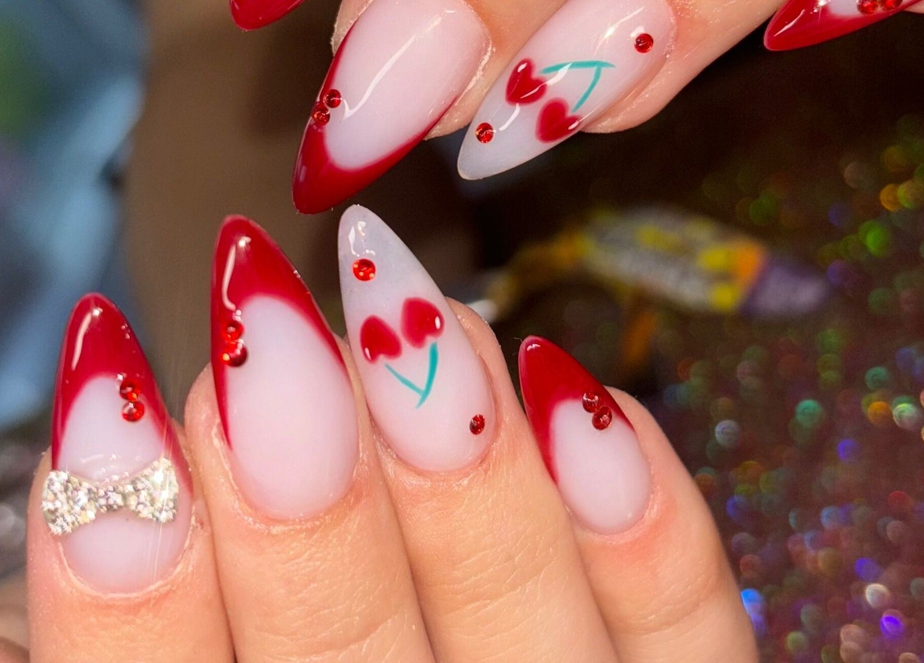 Elegant red-tipped nail art at Luxe Beauty MK, Crownhill, England, GB. Perfect for a sophisticated style.