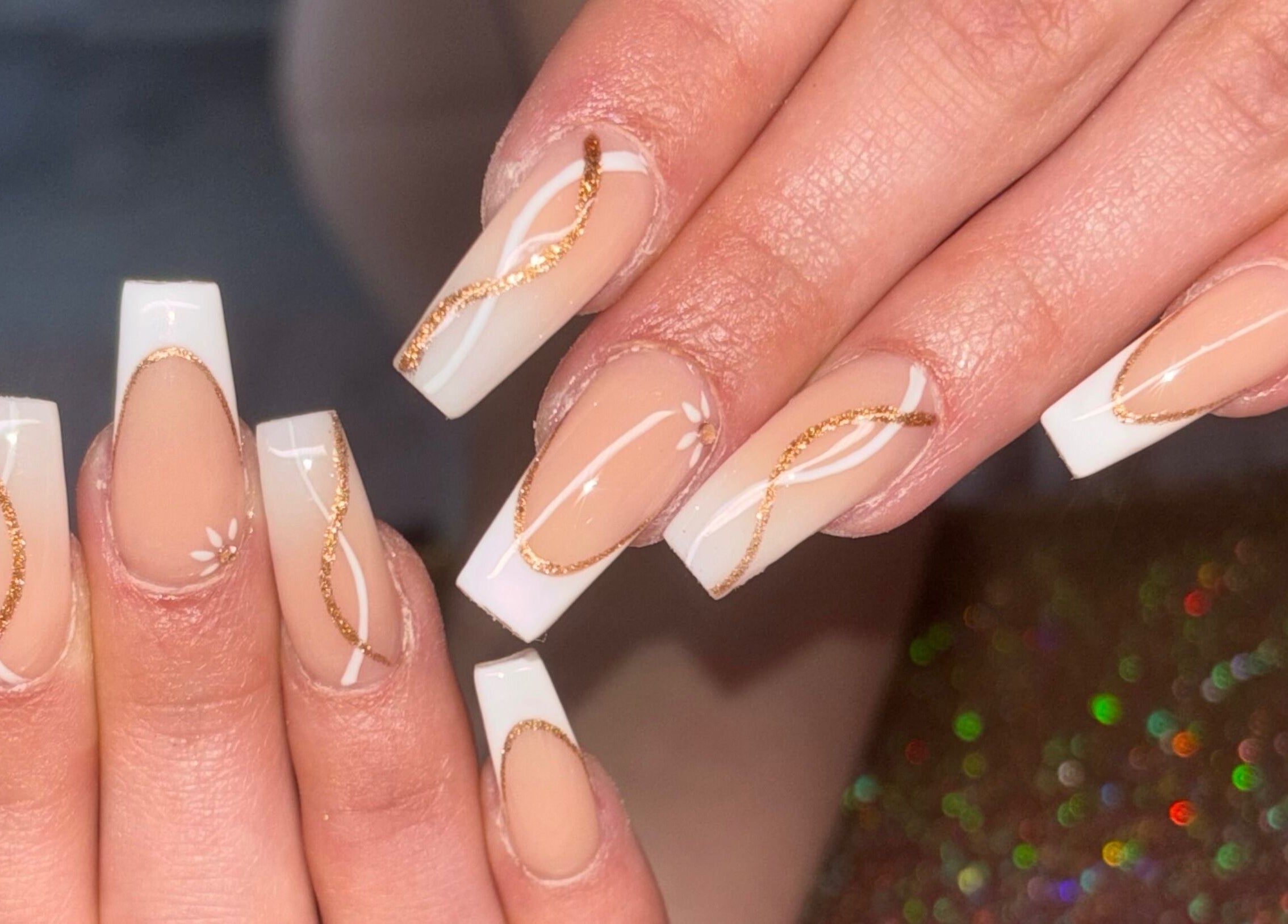 Stunning nail art with gold accents at Luxe Beauty MK, Crownhill, England, GB.