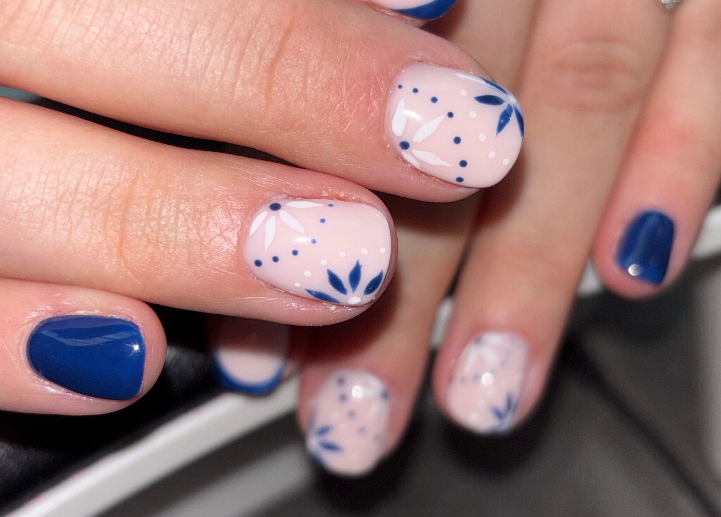 Elegant blue and white floral nail art at Luxe Beauty MK, Crownhill, England, GB.