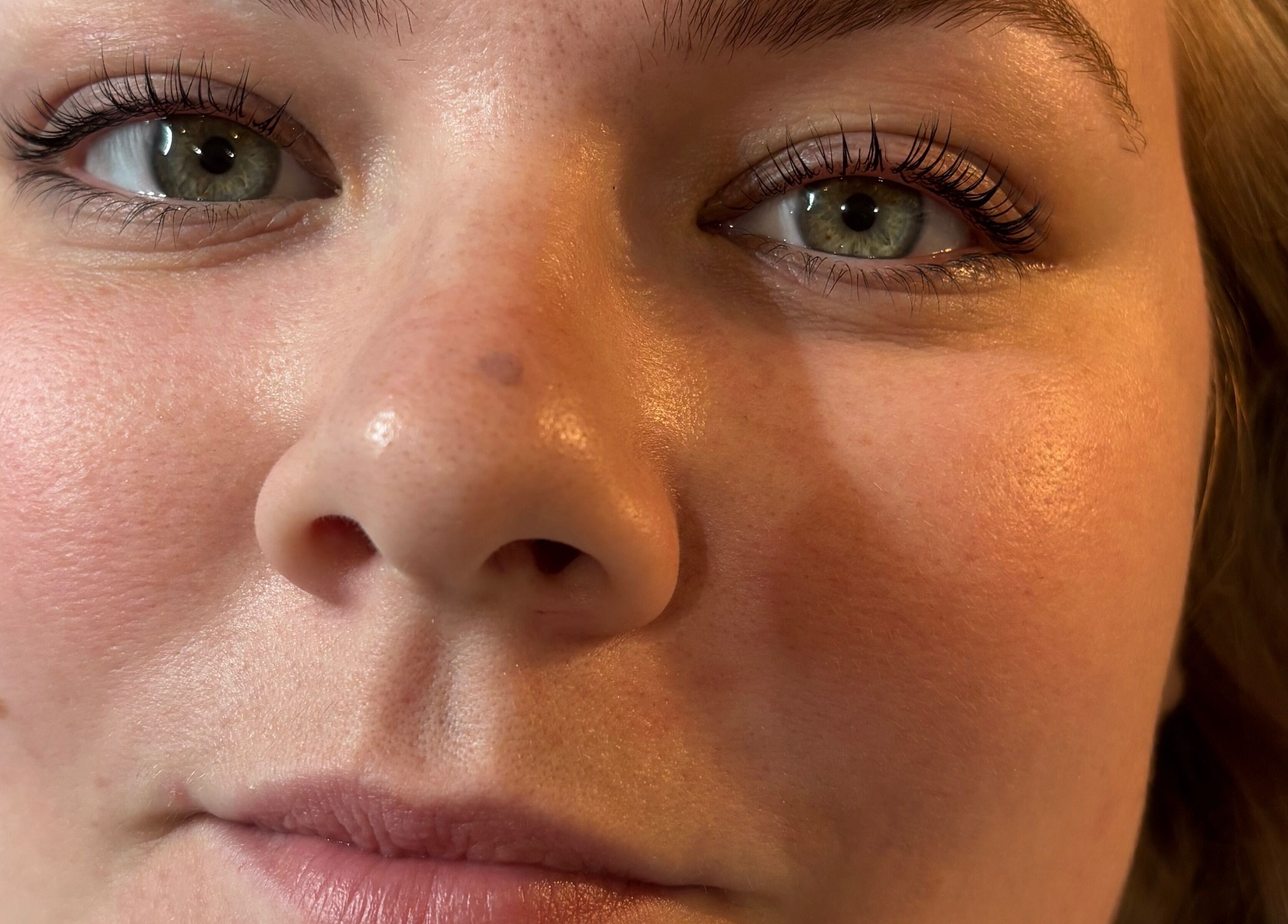 Close-up of woman's face with natural makeup at Luxe Beauty MK, Crownhill, England, GB.
