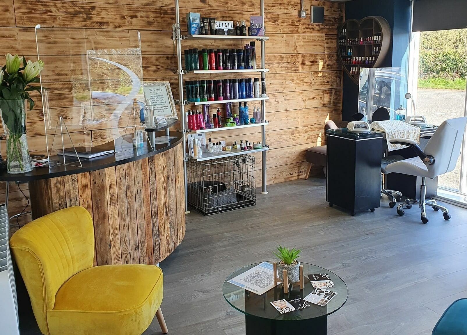 Modern beauty salon interior at Illusions, Redruth, England, GB, featuring vibrant decor and serene ambiance.