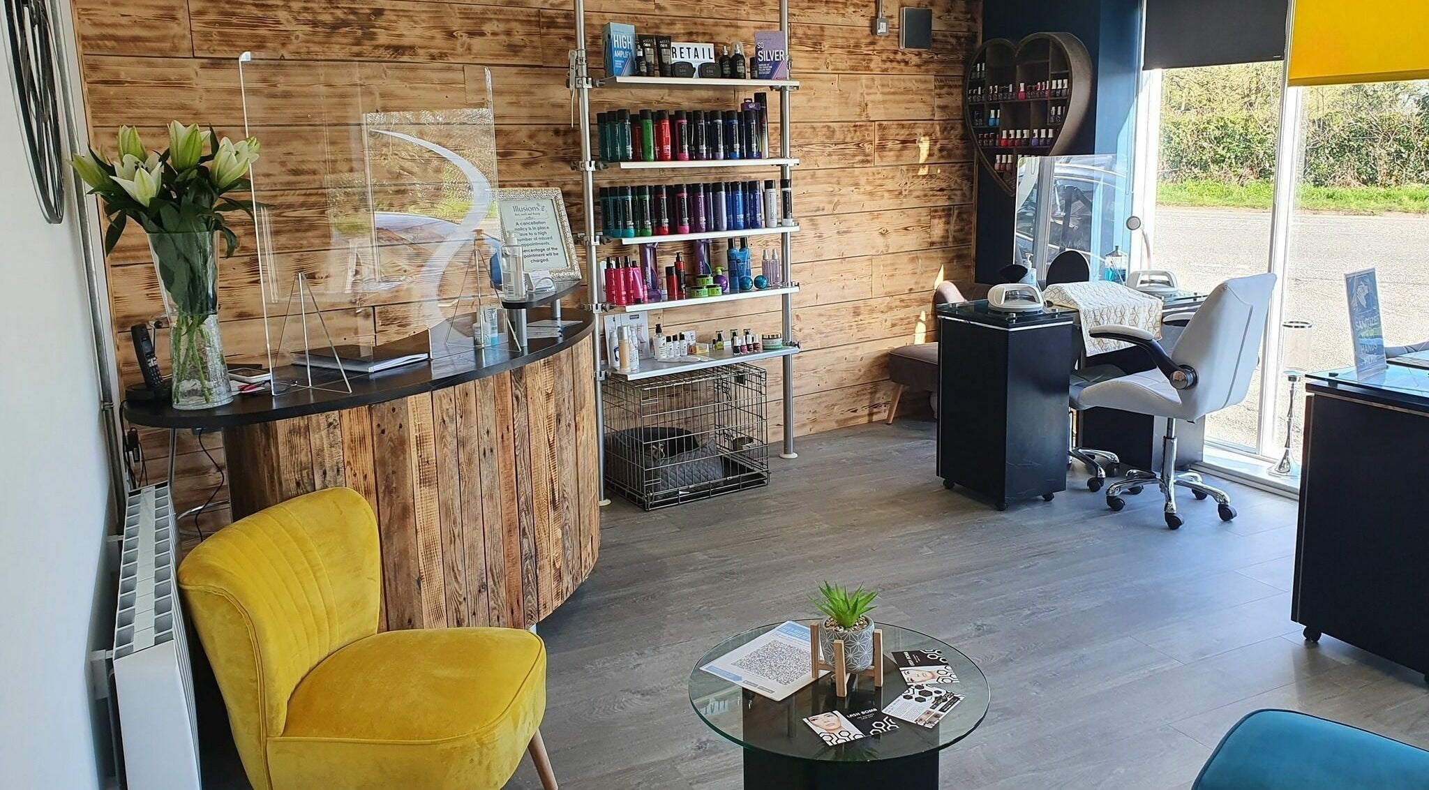 Modern beauty salon interior at Illusions, Redruth, England, GB, featuring vibrant decor and serene ambiance.
