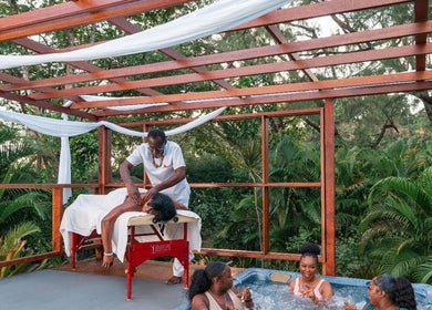 Relaxing massage and hot tub at The Bamboo Retreat, St. George, BB surrounded by lush greenery.