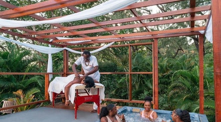 Relaxing massage and hot tub at The Bamboo Retreat, St. George, BB surrounded by lush greenery.