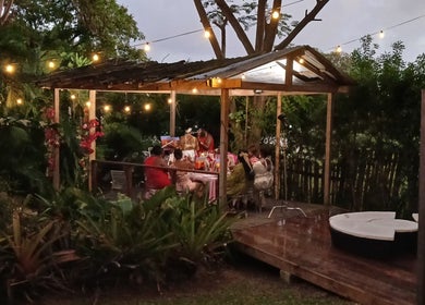 Charming evening gathering at The Bamboo Retreat's lush garden in St. George, BB.