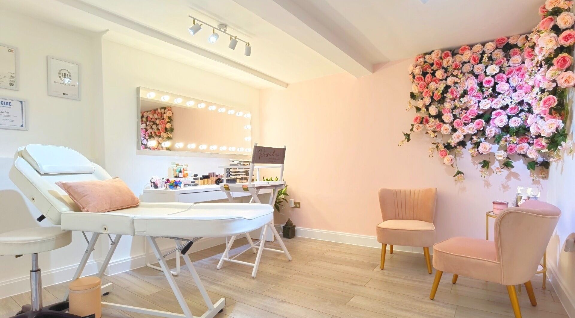 Rosita Permanent Cosmetics & Makeup Artist salon in London, England, GB features elegant seating and floral decor.