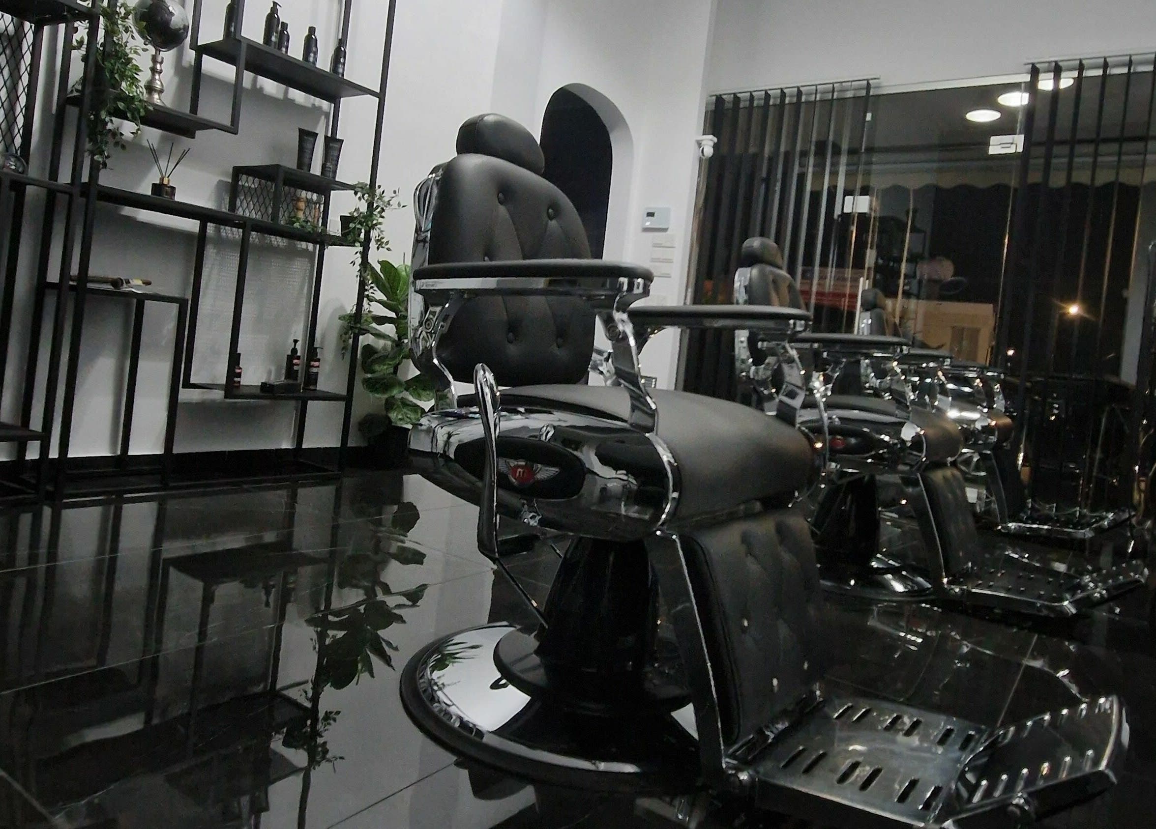 Modern barber chairs at Udomo Barber and Nail Studio, Paphos, Paphos, CY, showcasing sleek design.