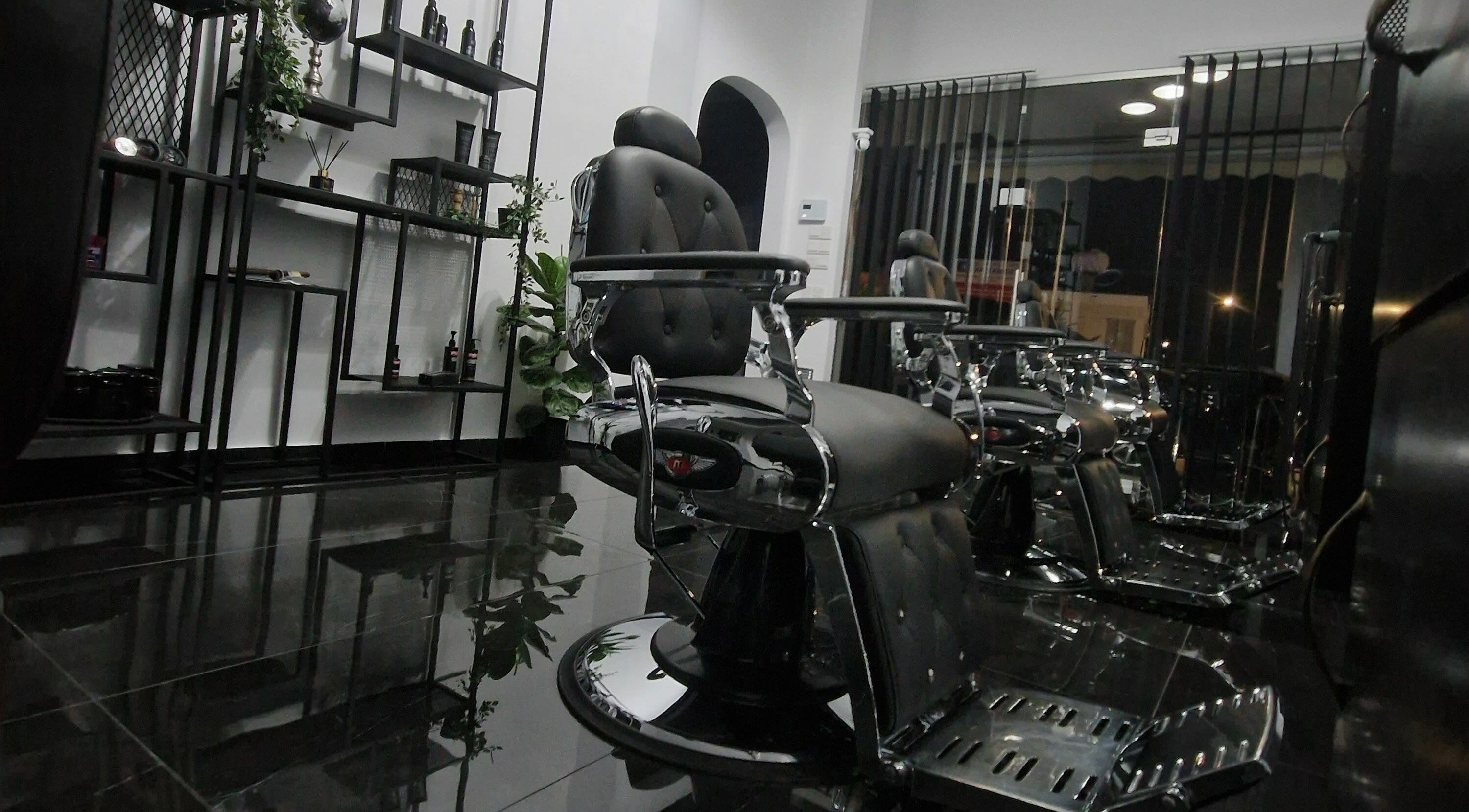 Modern barber chairs at Udomo Barber and Nail Studio, Paphos, Paphos, CY, showcasing sleek design.