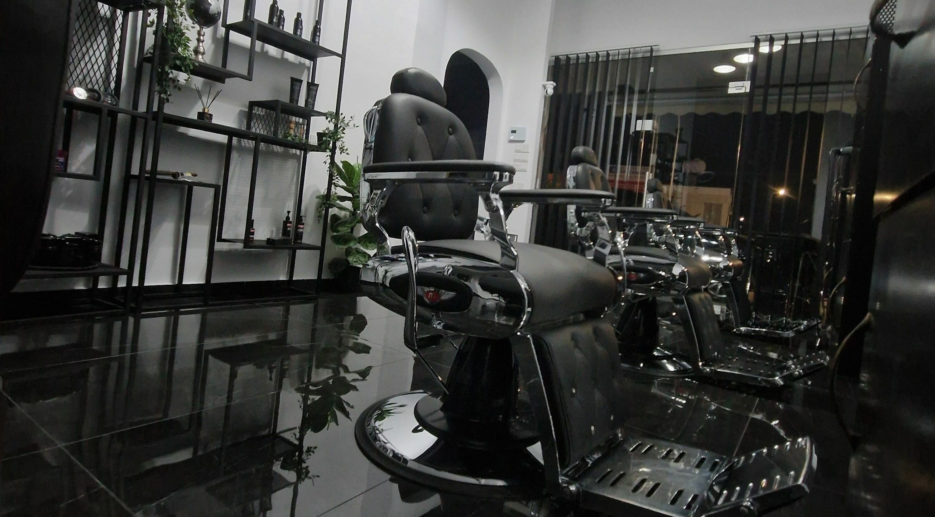 Modern barber chairs at Udomo Barber and Nail Studio, Paphos, Paphos, CY, showcasing sleek design.
