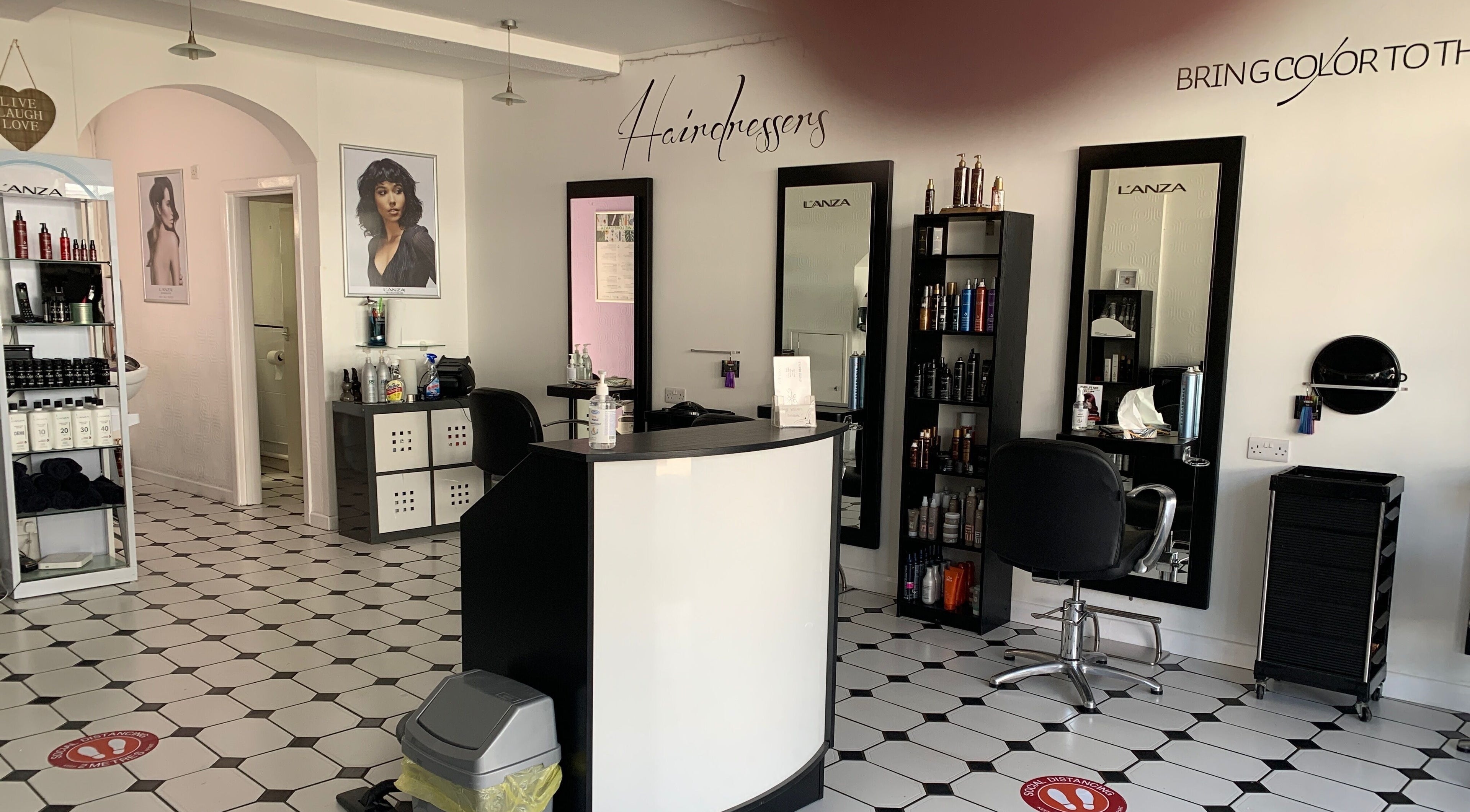 Modern interior of Hair Ology Wimborne in Wimborne Minster, England, GB, showcasing stylish salon design.