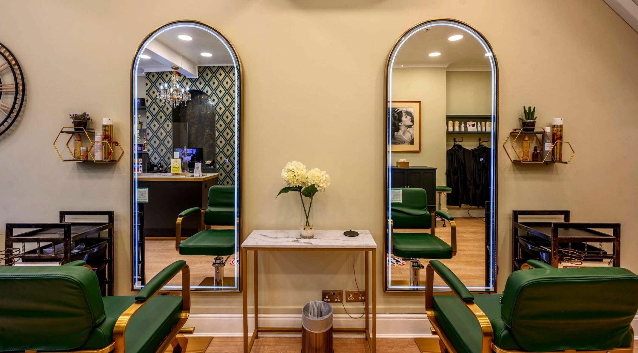 Reflection area at Brazilian Look Fulham, London, England, GB featuring elegant decor and green chairs.