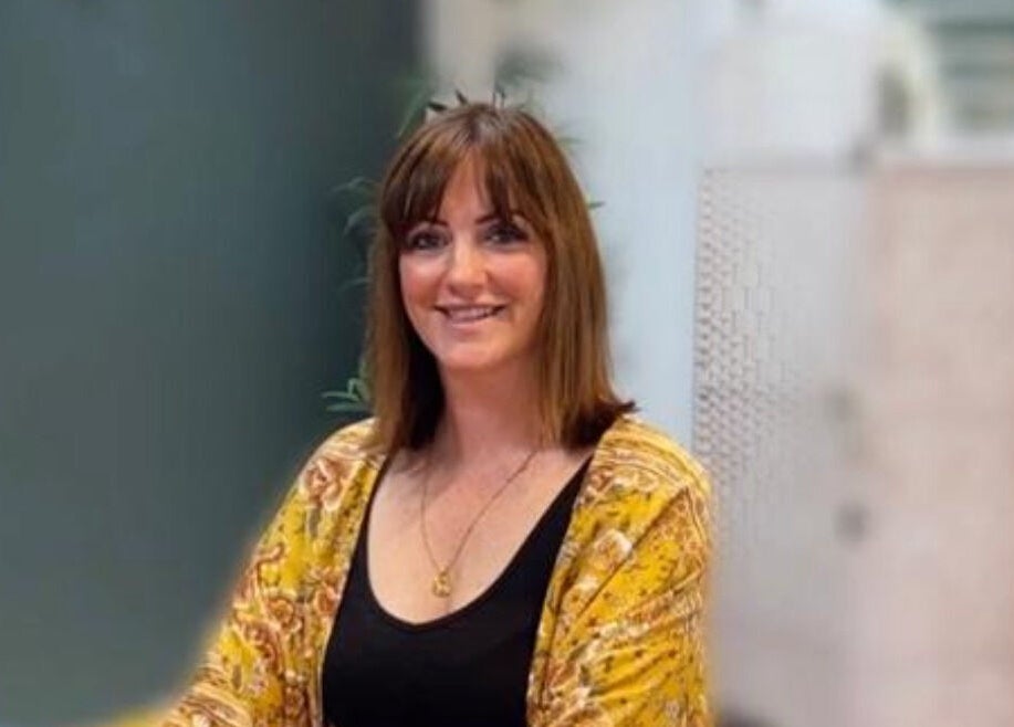 Therapist at Sarah Watters Health & Beauty, Dublin, County Dublin, IE, smiling warmly in a serene setting.