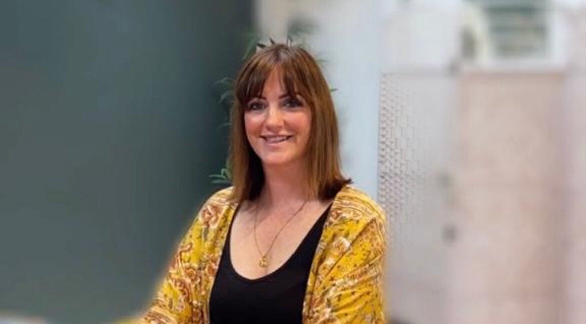 Therapist at Sarah Watters Health & Beauty, Dublin, County Dublin, IE, smiling warmly in a serene setting.