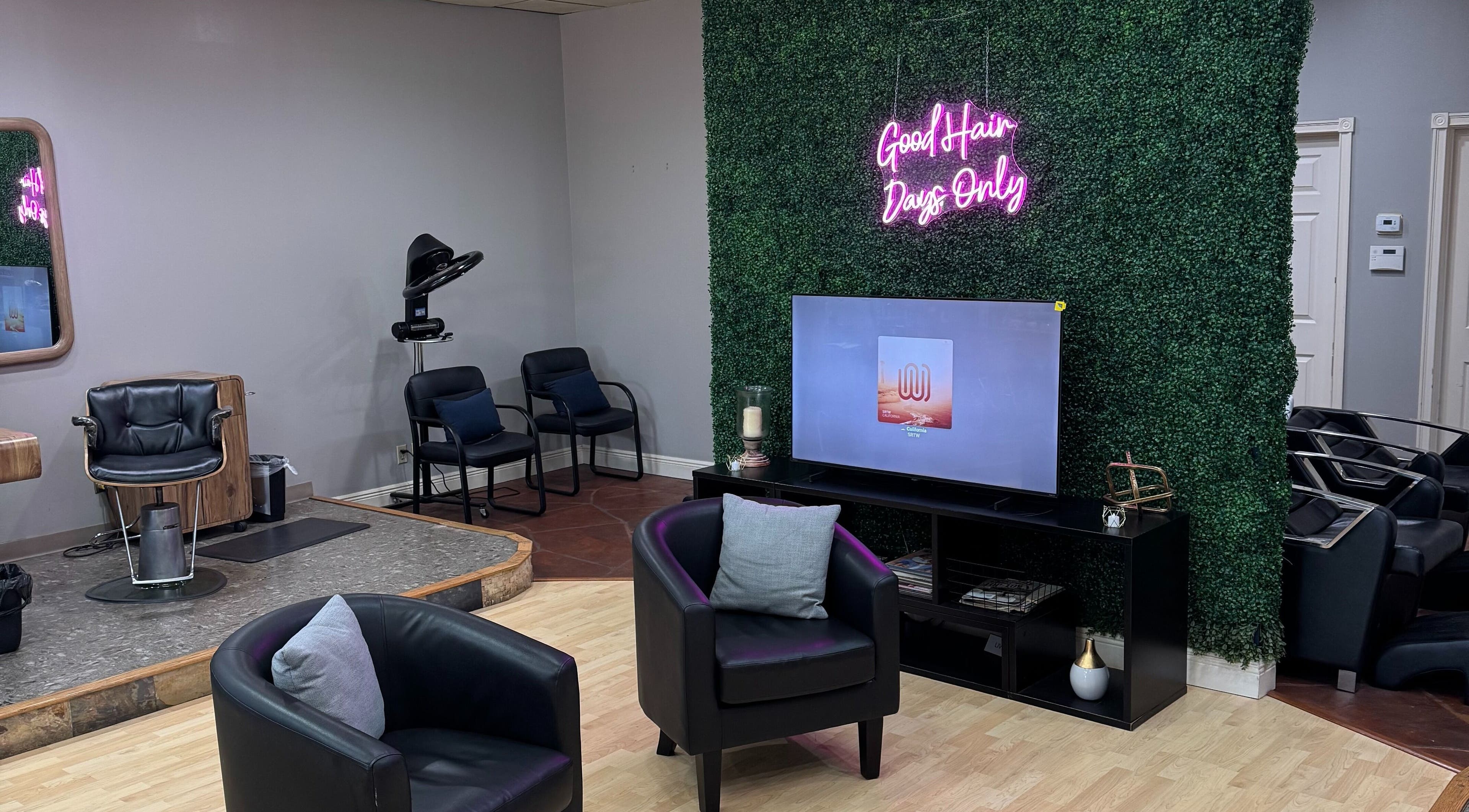 Modern interior of Simply Irresistible Salon in Katy, Texas, US with stylish chairs and vibrant wall art.