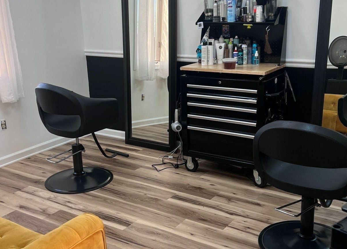 Elegant interior of The Color Lab in Harrisonburg, Virginia, US showcasing modern salon chairs and styling tools.