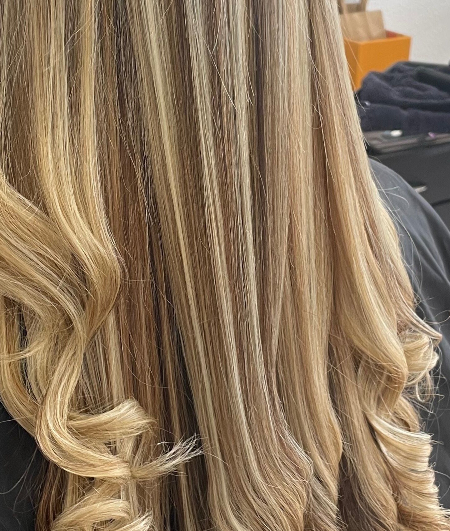 Radiant blonde curls styled at Hairwithmichele, located in Haleiwa, Hawaii, US.
