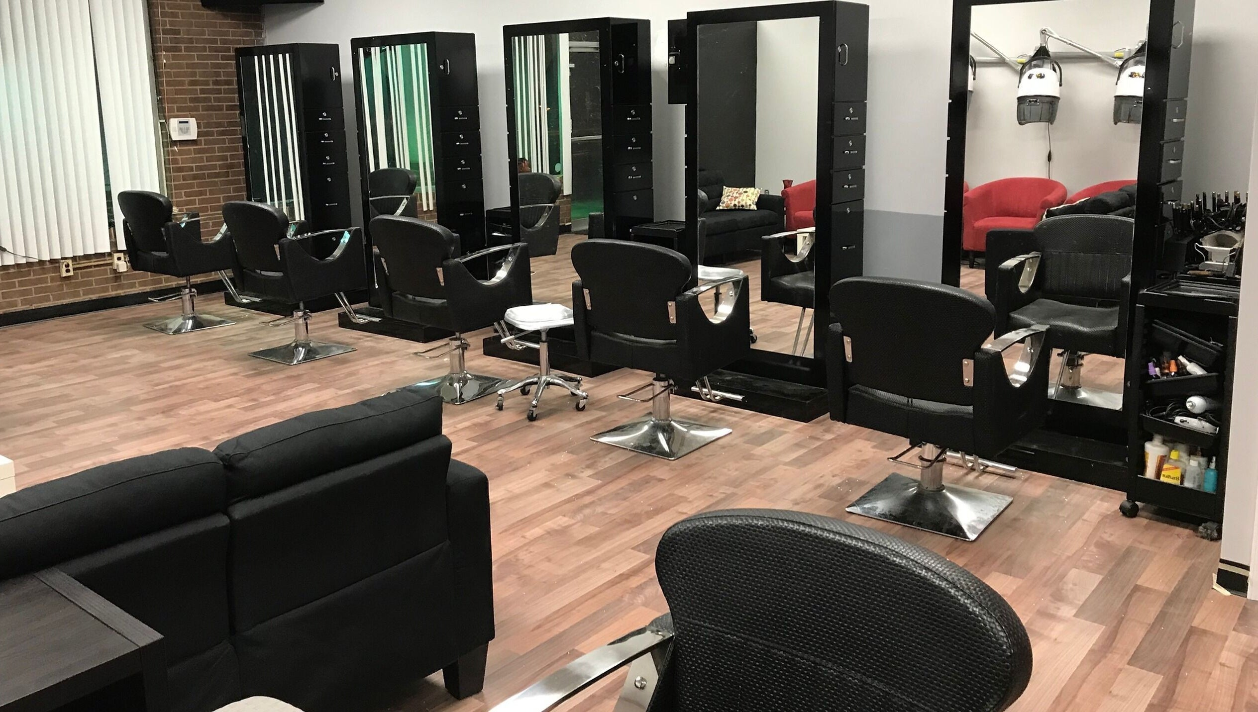 Modern salon chairs and mirrors at Xclusive Salon Suites, Clinton, Maryland, US, showcasing a sleek interior.