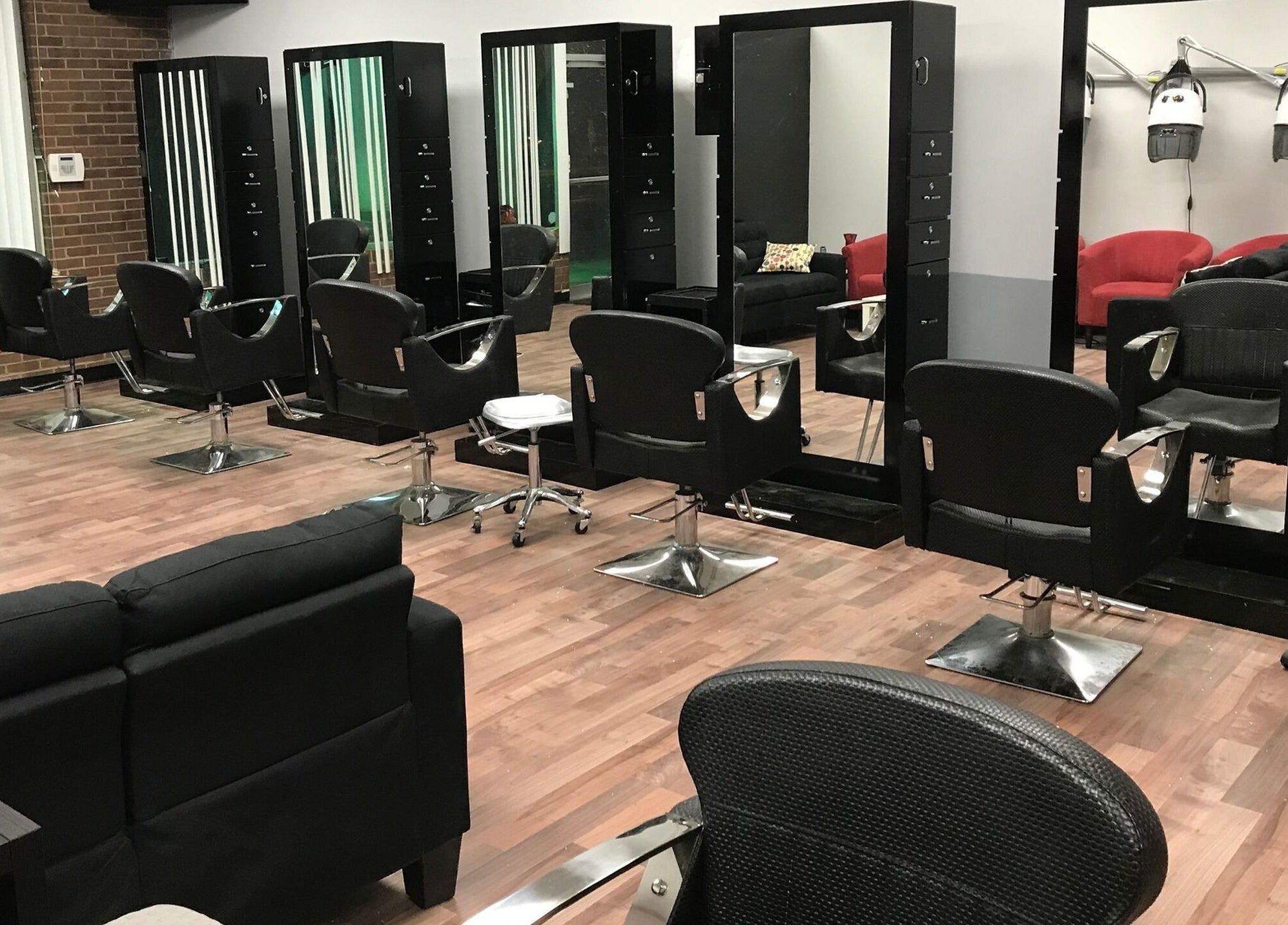 Modern salon chairs and mirrors at Xclusive Salon Suites, Clinton, Maryland, US, showcasing a sleek interior.