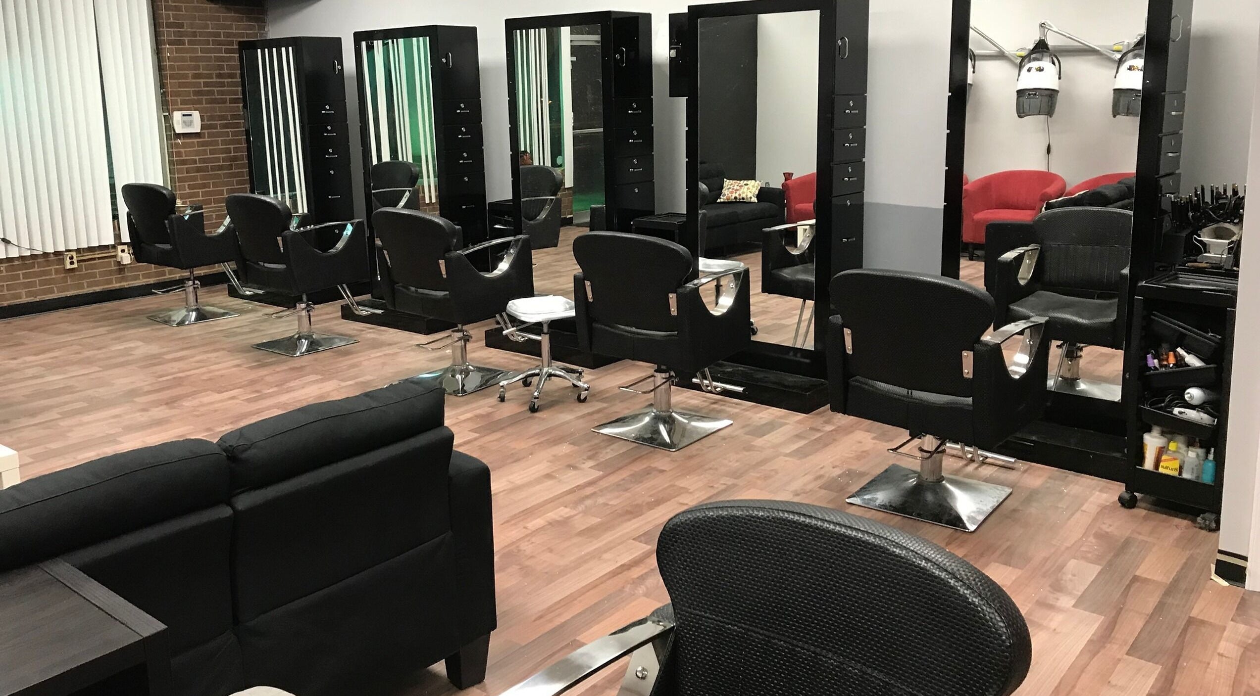 Modern salon chairs and mirrors at Xclusive Salon Suites, Clinton, Maryland, US, showcasing a sleek interior.