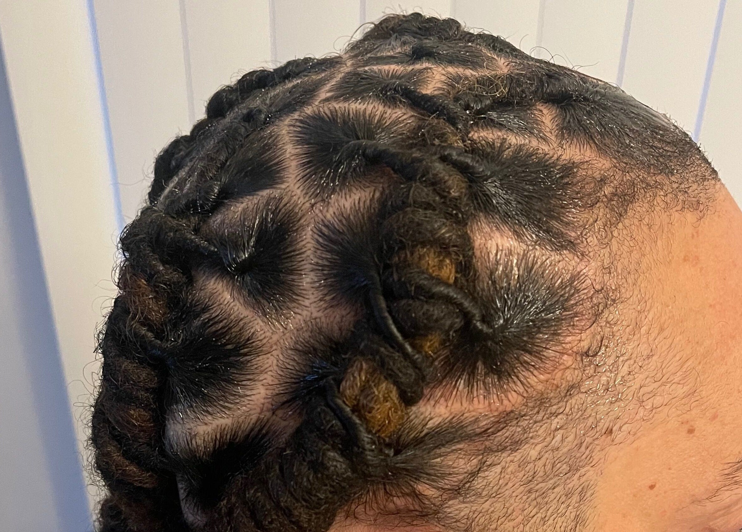 Intricate braided hairstyle at Xclusive Salon Suites, Clinton, Maryland, US showcasing detailed craftsmanship.