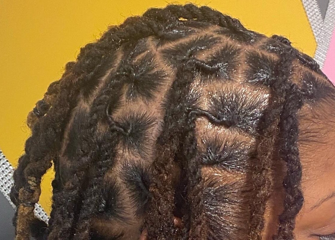 Stylish braided hairstyle at Xclusive Salon Suites, Clinton, Maryland, US showcasing expert craftsmanship.