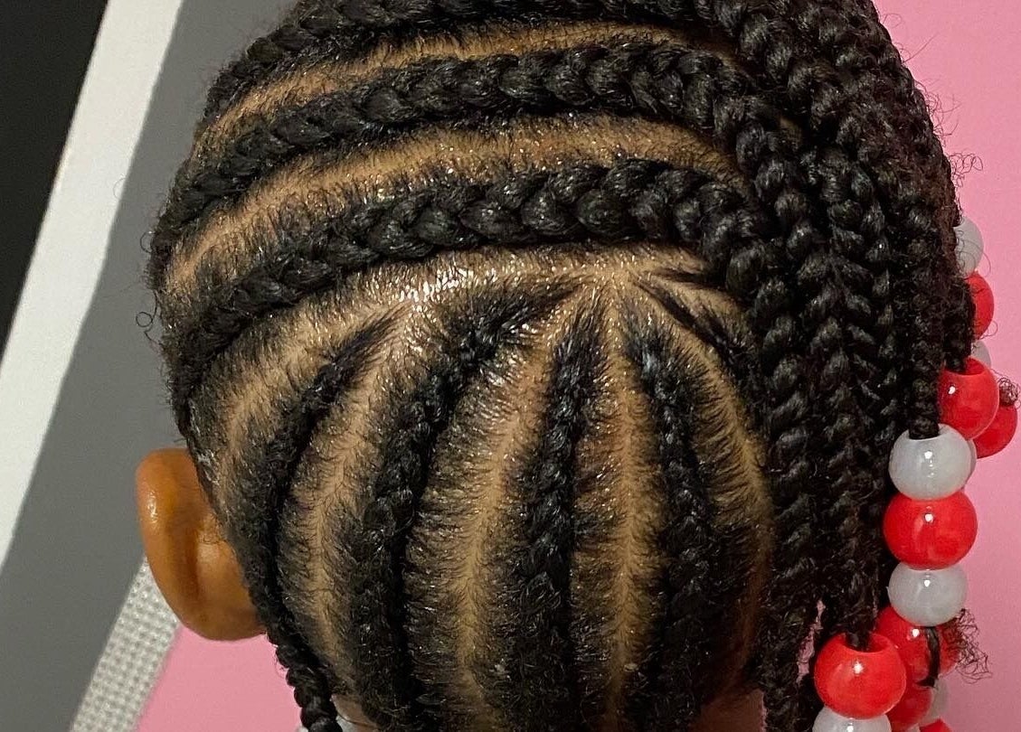 Intricate braided hairstyle with beads at Xclusive Salon Suites, Clinton, Maryland, US.