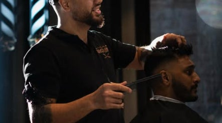 Barber styling hair at The Men's Grooming Circular Quay Gateway, Sydney, New South Wales, AU.