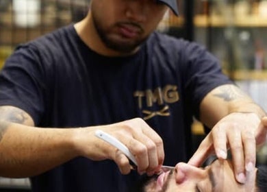 Barber expertly shaping beard at The Men's Grooming Circular Quay Gateway, Sydney, New South Wales, AU.