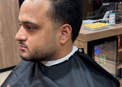 Client at The Men's Grooming Circular Quay Gateway in Sydney, New South Wales, AU getting a stylish haircut.