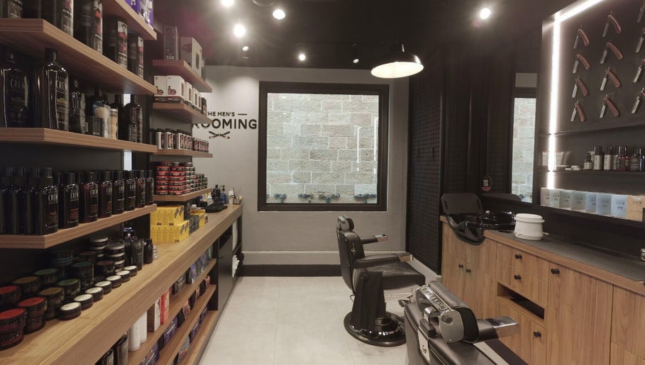 Interior of The Mens Grooming - Quay Quarter in Sydney, NSW, showcasing barber chairs and product shelves.