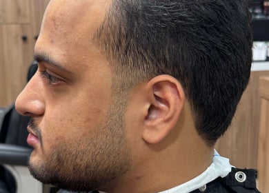 Side profile of man with fresh haircut at The Mens Grooming - Quay Quarter, Sydney, New South Wales, AU.