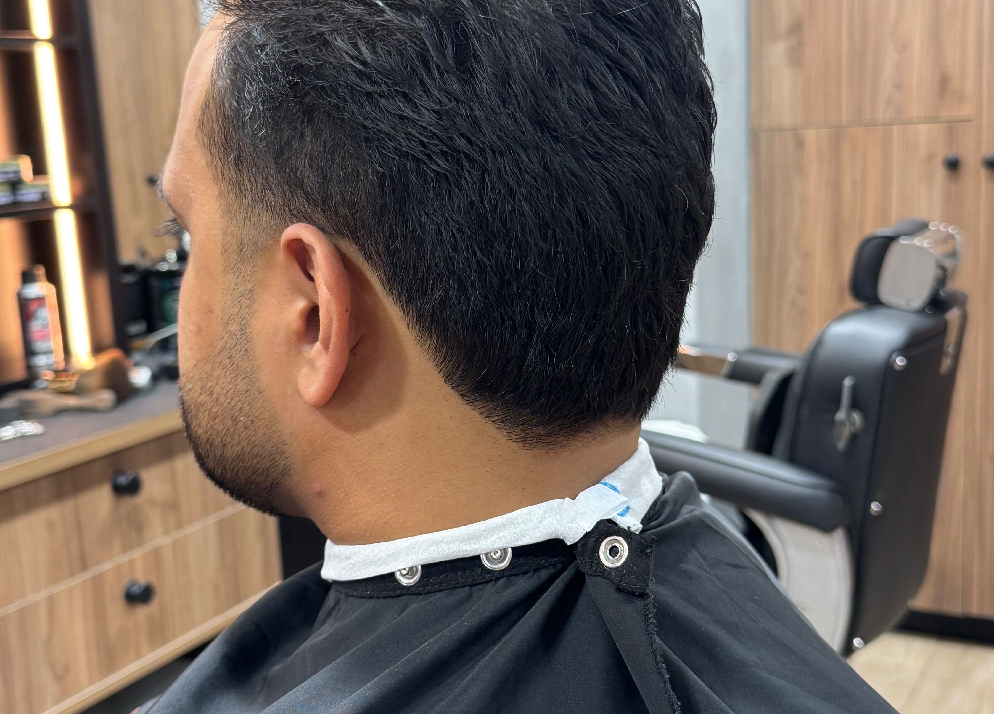 Man's haircut in progress at The Men's Grooming Circular Quay Gateway in Sydney, New South Wales, AU.