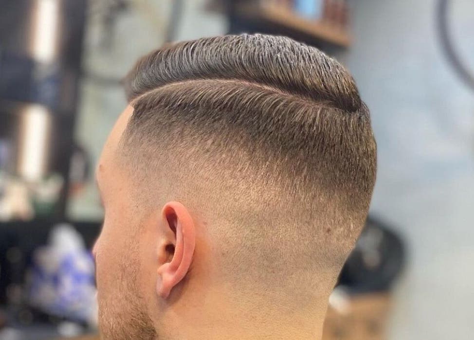 Close-up of a trendy fade haircut at The Men's Grooming Circular Quay Gateway, Sydney, New South Wales, AU.